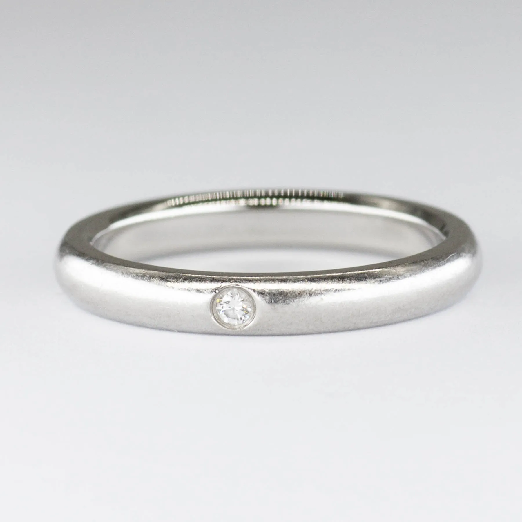 Elegant Platinum Band Ring by Tiffany & Co. Designed by Elsa Peretti, Featuring a 0.02ctw Diamond, Size 7