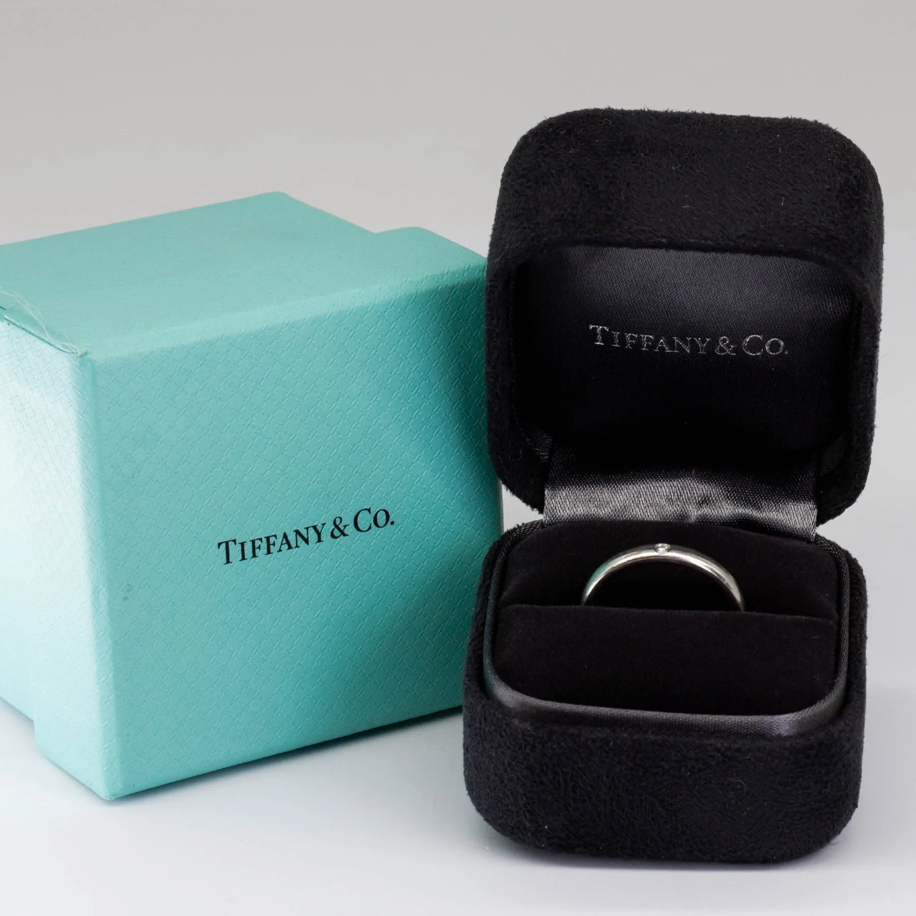 Elegant Platinum Band Ring by Tiffany & Co. Designed by Elsa Peretti, Featuring a 0.02ctw Diamond, Size 7